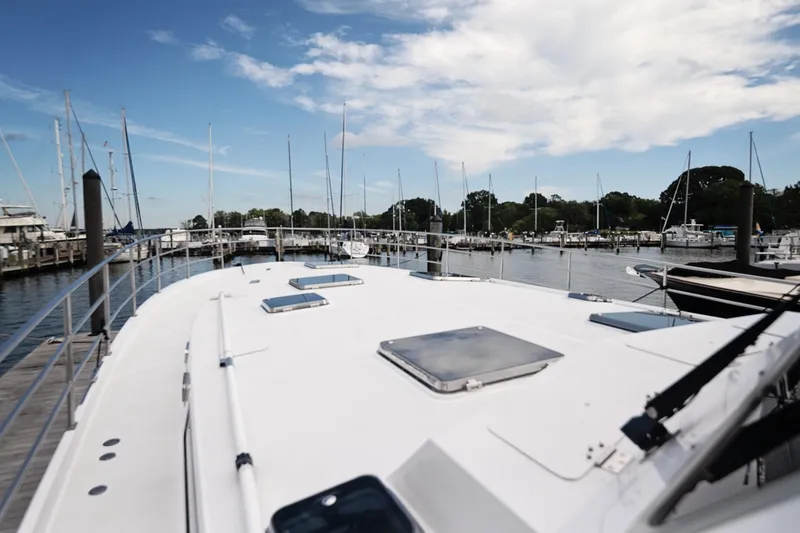Slide: The Image of 2007 Pilot Cruiser Expedition yacht docked at a marina under a blue sky. - 69
