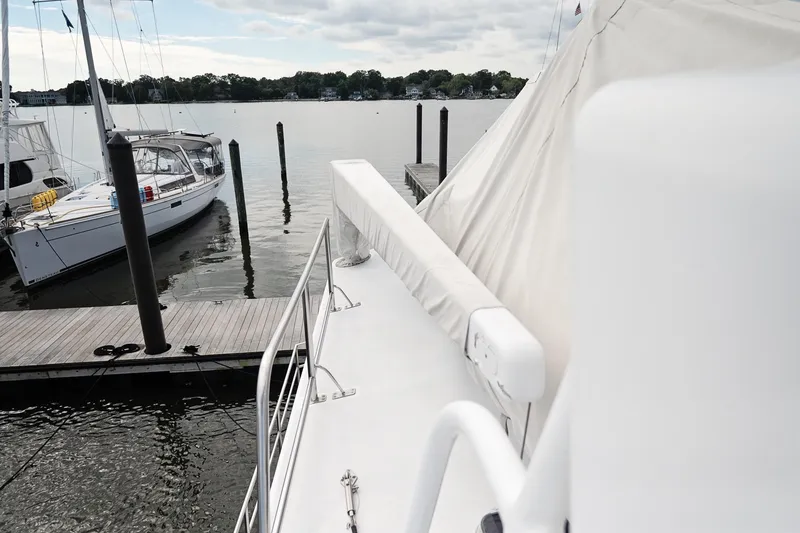 Slide: The Image of 2007 Pilot Cruiser Expedition yacht docked at marina, calm waters, overcast sky. - 71