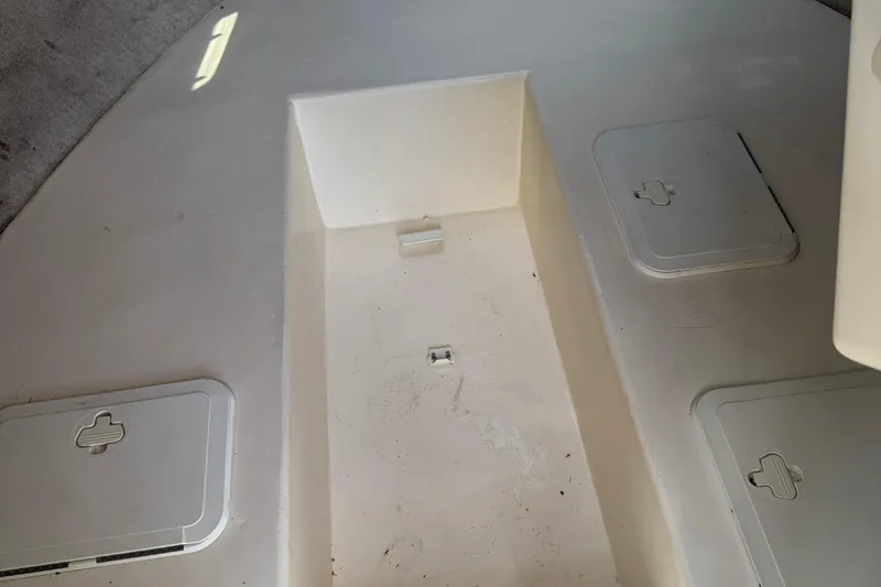 Slide: The Image of 2008 Parker 2510 XL Walkaround boat deck with storage compartments. - 14