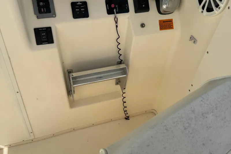 Slide: The Image of Control panel of a 2008 Parker 2510 XL Walkaround boat interior. - 18