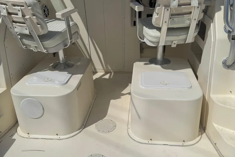 Slide: The Image of 2008 Parker 2510 XL Walkaround boat interior with two cushioned seats. - 19