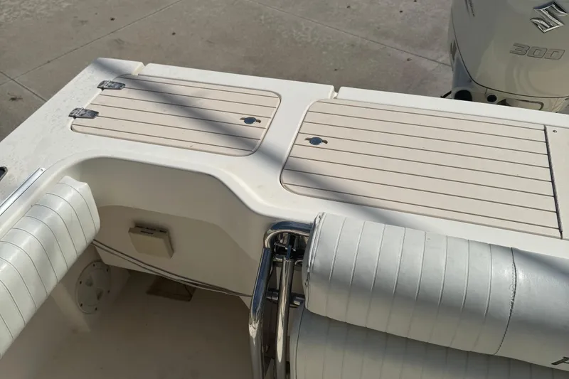 Slide: The Image of 2008 Parker 2510 XL Walkaround boat interior with Suzuki 300 engine. - 22