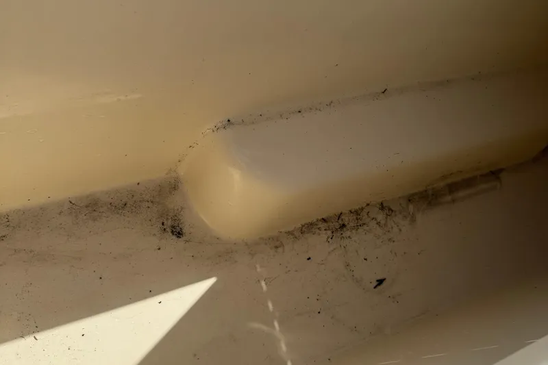 Slide: The Image of Interior of a 2008 Parker 2510 XL Walkaround boat, showing dirt accumulation. - 25