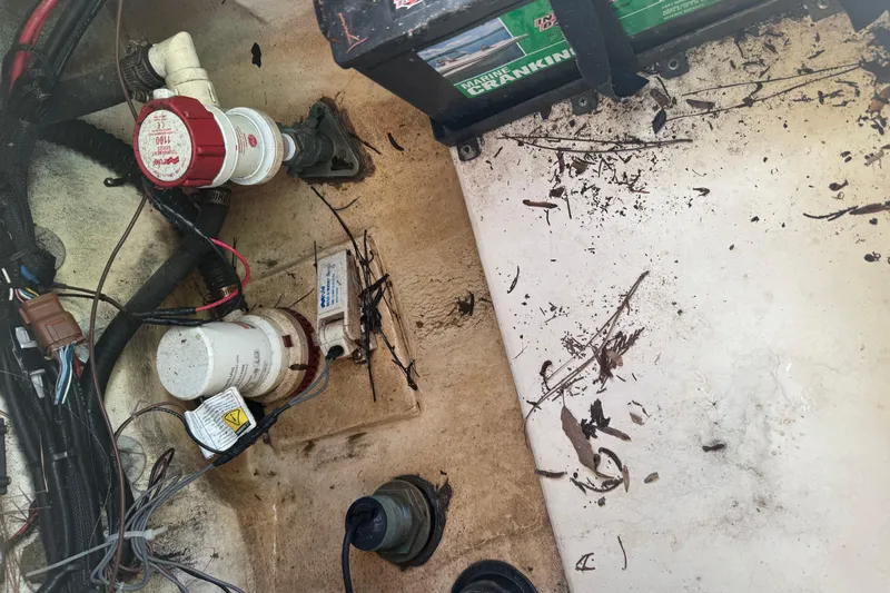 Slide: The Image of 2008 Parker 2510 XL Walkaround boat interior with wiring and battery components. - 27