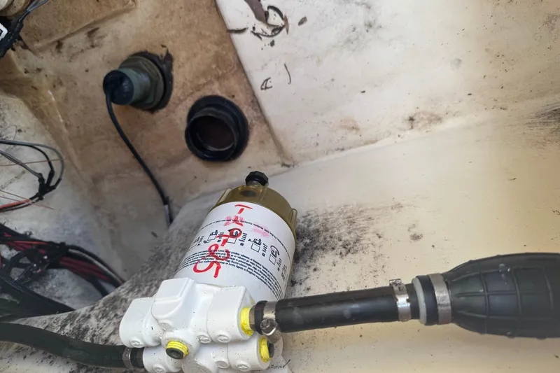 Slide: The Image of Fuel filter system in a 2008 Parker 2510 XL Walkaround boat engine compartment. - 28