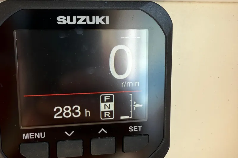 Slide: The Image of Suzuki engine display showing 283 hours on a 2008 Parker 2510 XL Walkaround. - 31