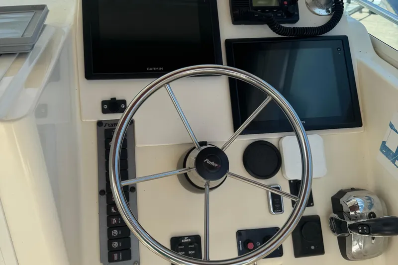 Slide: The Image of Steering console of a 2008 Parker 2510 XL Walkaround boat with Garmin displays. - 7
