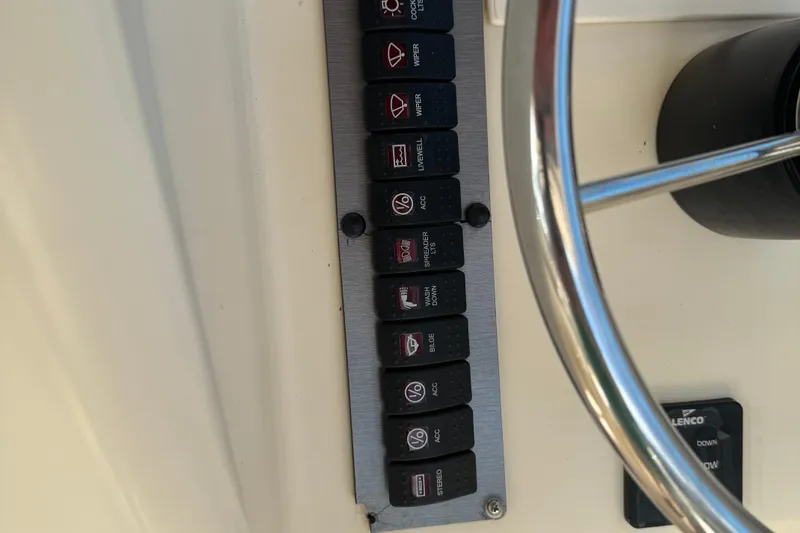 Slide: The Image of Control panel of a 2008 Parker 2510 XL Walkaround boat with labeled switches. - 8