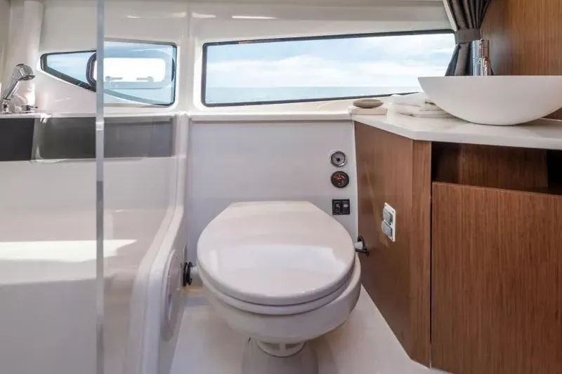Slide: The Image of Interior of 2026 Beneteau Antares 11 Coupe with ocean view and cozy seating area. - 9