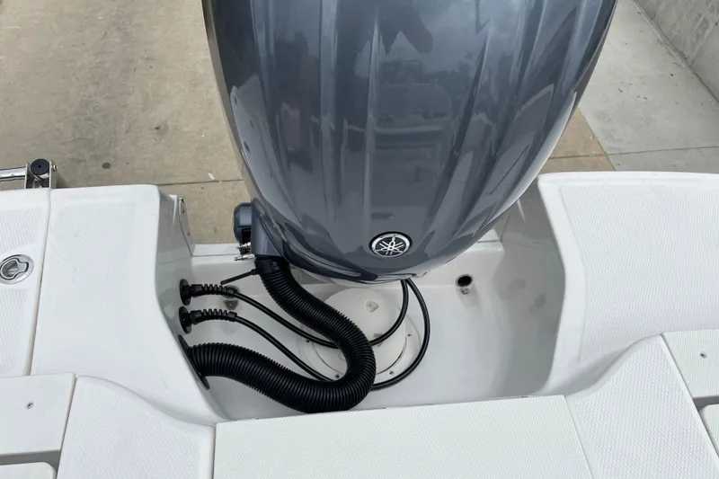 Slide: The Image of 2026 Robalo R180 Center Console boat engine compartment with Yamaha outboard motor. - 14