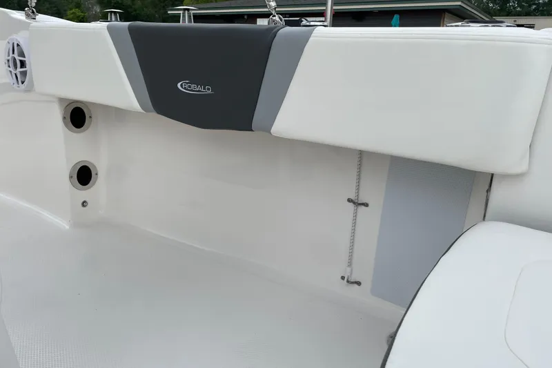 Slide: The Image of 2026 Robalo R180 Center Console interior with white and gray seating detail. - 15