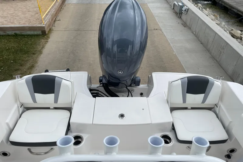 Slide: The Image of 2026 Robalo R180 Center Console boat with dual seating and outboard motor. - 22