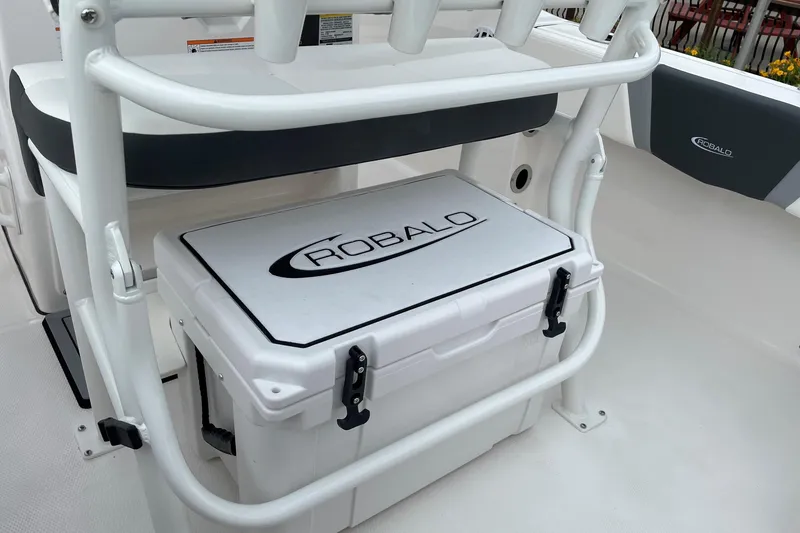 Slide: The Image of 2026 Robalo R180 Center Console boat with integrated cooler and seating. - 24