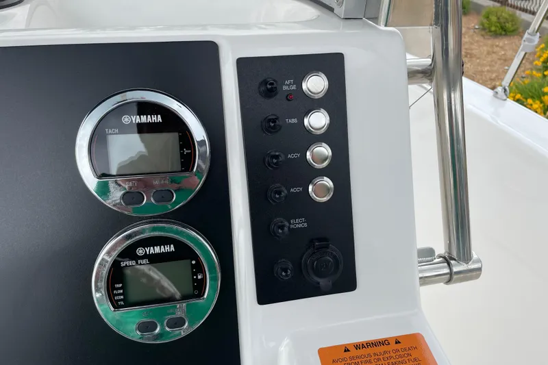 Slide: The Image of 2026 Robalo R180 Center Console dashboard with Yamaha gauges and control panel. - 26