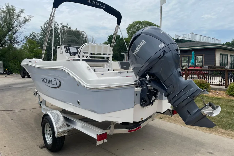 Slide: The Image of 2026 Robalo R180 Center Console boat with Yamaha outboard motor on trailer. - 5