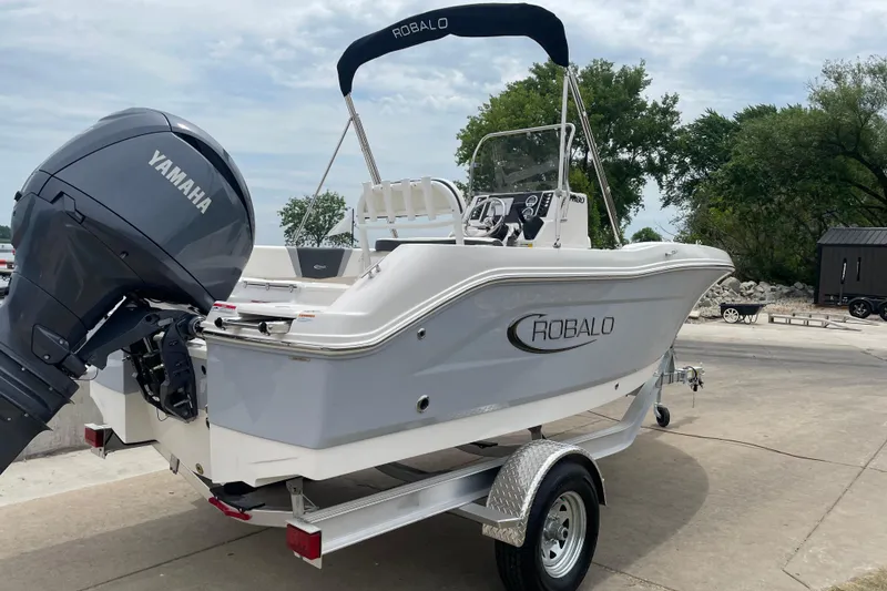 Slide: The Image of 2026 Robalo R180 Center Console boat with Yamaha engine on trailer. - 7