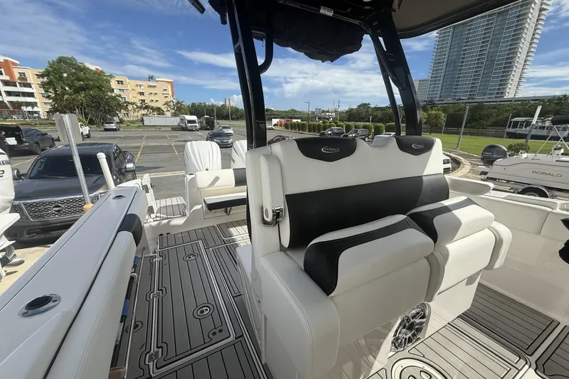 Slide: The Image of 2023 Robalo R302 Center Console boat interior with modern seating and sleek design. - 3