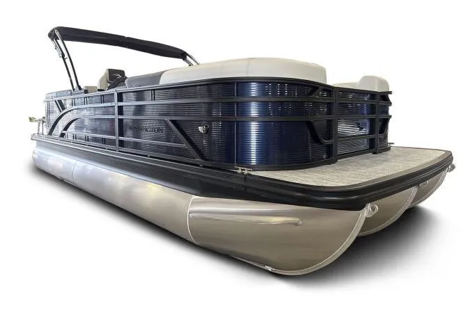 Slide: The Image of 2026 Bennington 22 SSRSE pontoon boat in a warehouse setting. - 1