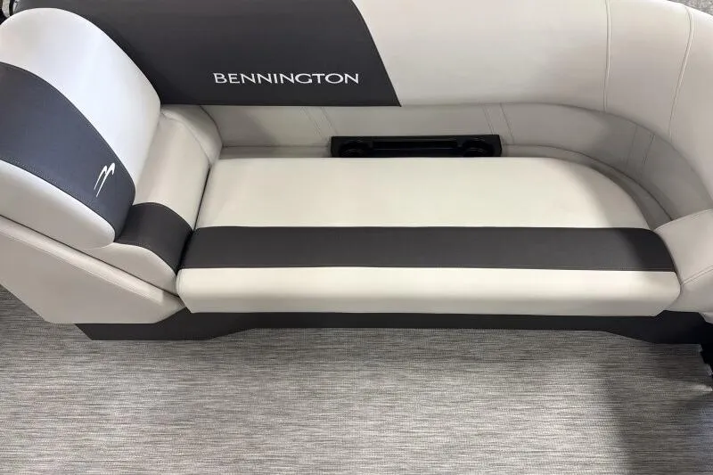 Slide: The Image of 2026 Bennington 22 SSRSF boat interior with cushioned seating and cupholder table. - 18