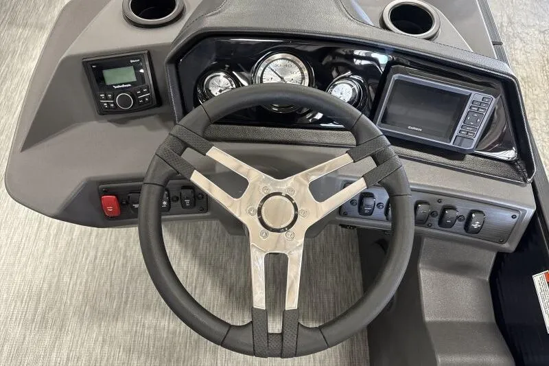 Slide: The Image of 2026 Bennington 22 SSRSF pontoon boat interior with gray seating and central table. - 19