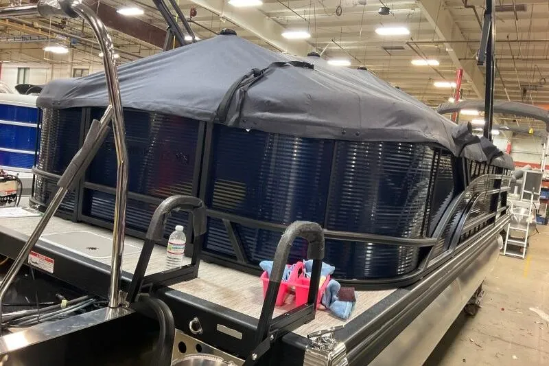 Slide: The Image of 2026 Bennington 22 SSRSF pontoon boat in a showroom, side view. - 9