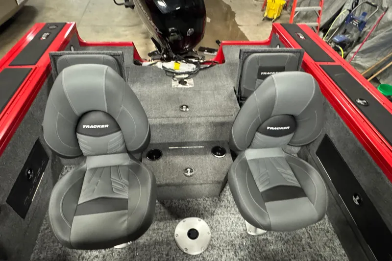 Slide: The Image of 2026 Tracker Targa V-18 Combo boat interior with gray seats and red accents. - 5