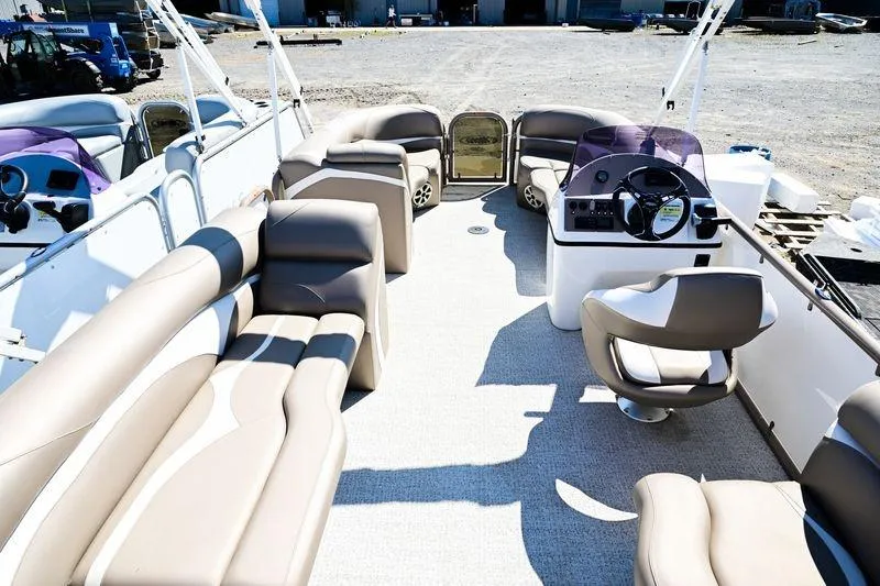 Slide: The Image of 2023 Aloha Pontoon Mahalo 23 interior with spacious seating and modern helm. - 12