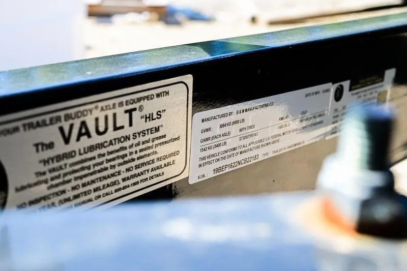 Slide: The Image of Close-up of a 2023 Aloha Pontoon 260 Tropical Series Sundeck label with specifications. - 13