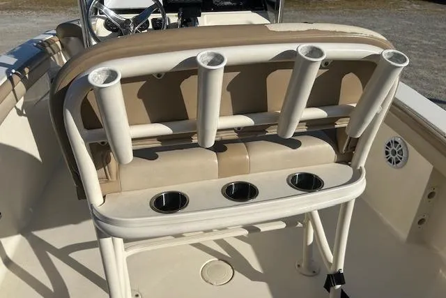 Slide: The Image of 2022 Scout 215 XSF boat interior with rod holders and cup holders. - 12