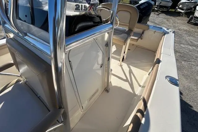 Slide: The Image of 2022 Scout 215 XSF boat interior with seating and console, showcasing sleek design. - 15