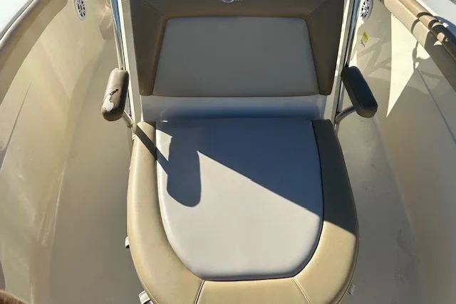 Slide: The Image of 2022 Scout 215 XSF boat seat with cushioned backrest and armrests. - 18