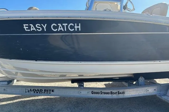 Slide: The Image of 2022 Scout 215 XSF boat named "Easy Catch" on Load Rite trailer. - 8