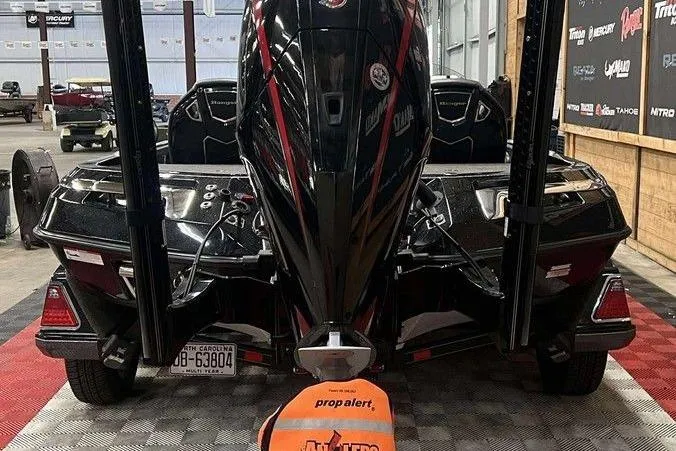 Slide: The Image of 2023 Ranger Z520R boat in a showroom, featuring a powerful outboard motor. - 4