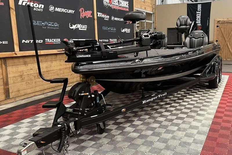 Slide: The Image of 2023 Ranger Z520R bass boat on display in showroom with branded backdrop. - 5