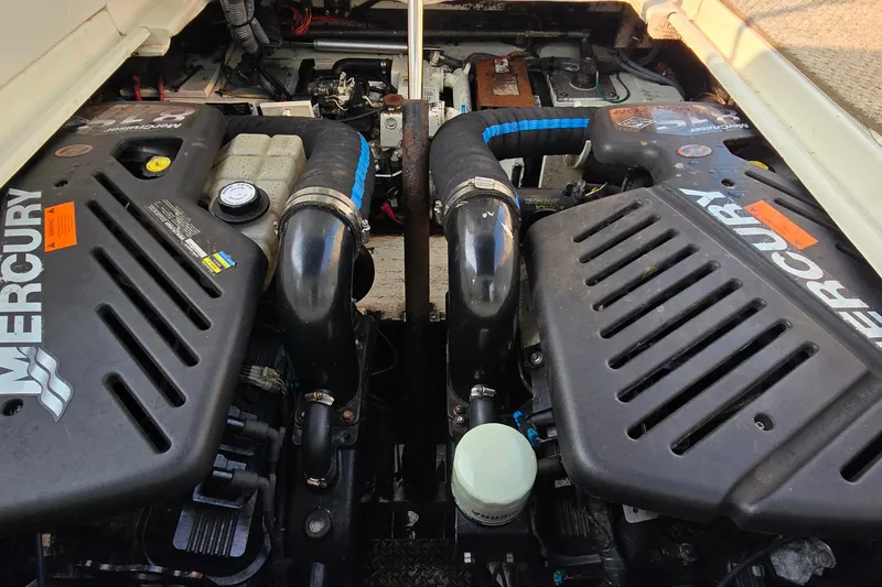 Slide: The Image of 2005 Cruisers Yachts 340 Express engine compartment with dual Mercury engines. - 13