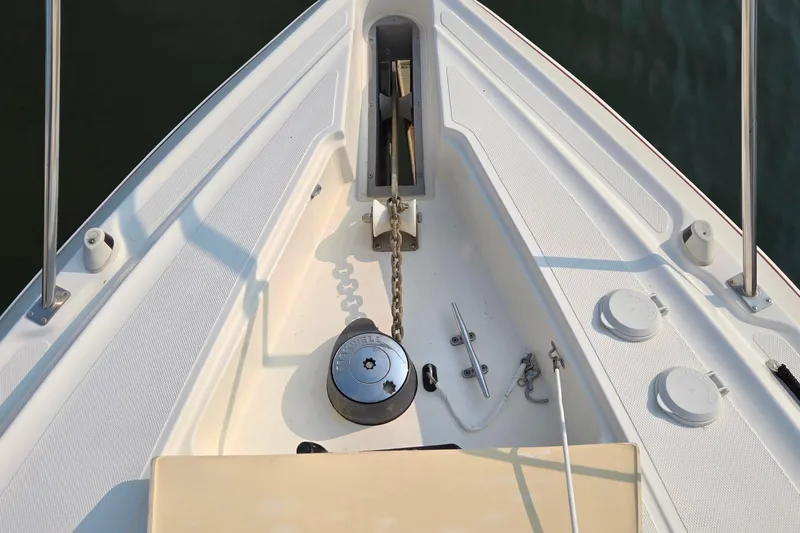 Slide: The Image of Bow of 2005 Cruisers Yachts 340 Express with anchor chain and winch. - 14