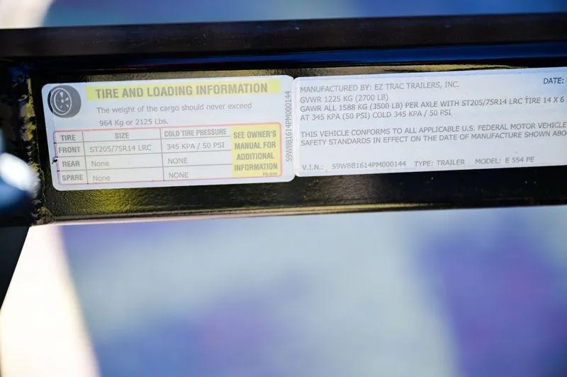 Slide: The Image of Tire and loading information label on 2023 Edge Duck Boats model 17 trailer. - 3