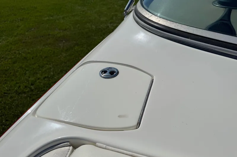 Slide: The Image of Close-up of a 2003 Cobalt 282 boat's white deck with a chrome detail. - 16