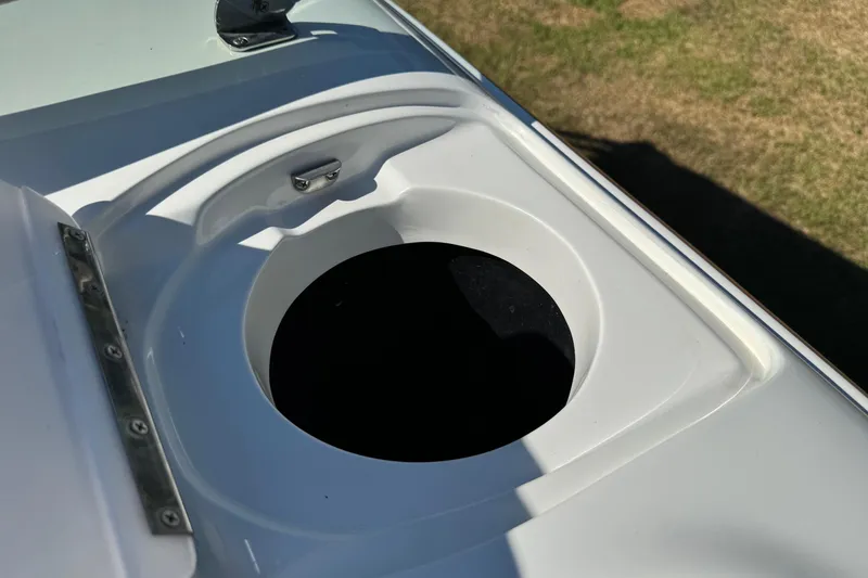 Slide: The Image of Cup holder on a 2003 Cobalt 282 boat, white surface, outdoor setting. - 18