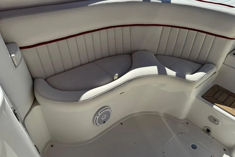 Slide: The Image of Luxurious seating area on a 2003 Cobalt 282 boat with white upholstery and speaker. - 28