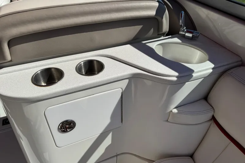 Slide: The Image of 2003 Cobalt 282 boat interior with cup holders and sink. - 30