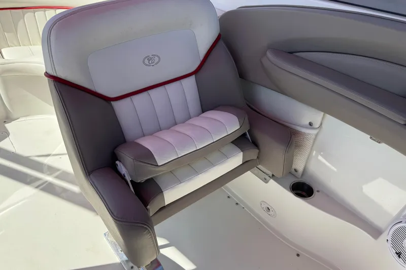 Slide: The Image of 2003 Cobalt 282 boat seat with gray and white upholstery, featuring red accents. - 36