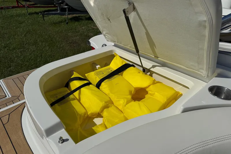 Slide: The Image of Open storage compartment on 2003 Cobalt 282 boat with yellow life jackets. - 40