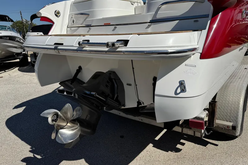 Slide: The Image of 2003 Cobalt 282 boat stern with propeller, parked on a trailer. - 41