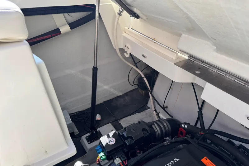 Slide: The Image of Engine compartment of a 2003 Cobalt 282 boat, showcasing mechanical components and wiring. - 6