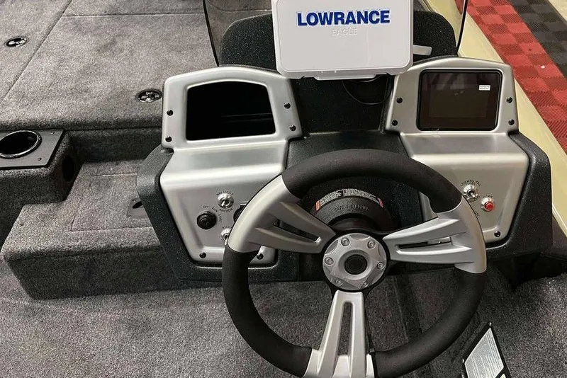 Slide: The Image of 2026 Tracker Pro Team 175 boat dashboard with steering wheel and Lowrance electronics. - 5