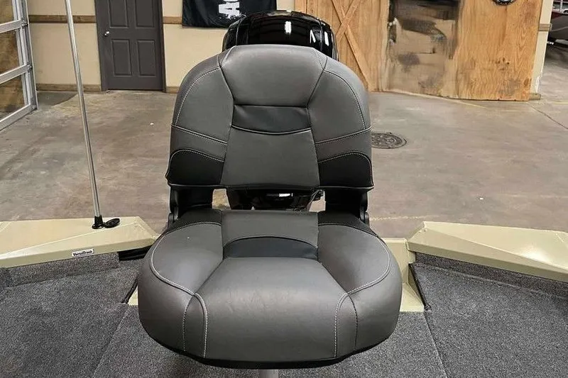 Slide: The Image of 2026 Tracker Pro Team 175 boat seat in a showroom setting. - 9