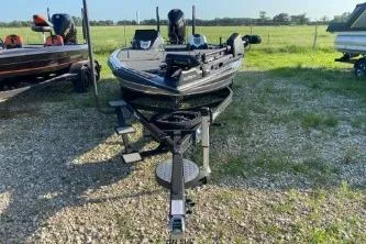 Slide: The Image of 2023 Blazer 650 Pro Tour boat on trailer in outdoor setting. - 2