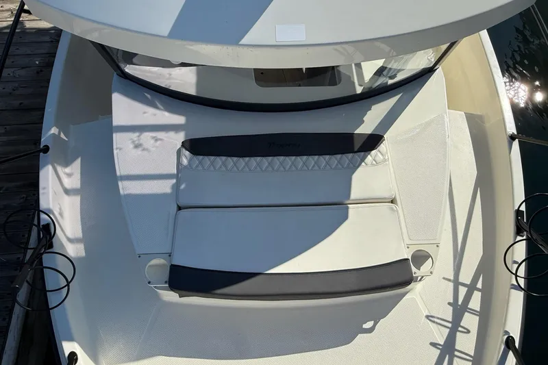 Slide: The Image of 2024 Bayliner Trophy T25 Pilothouse boat deck with cushioned seating. - 22