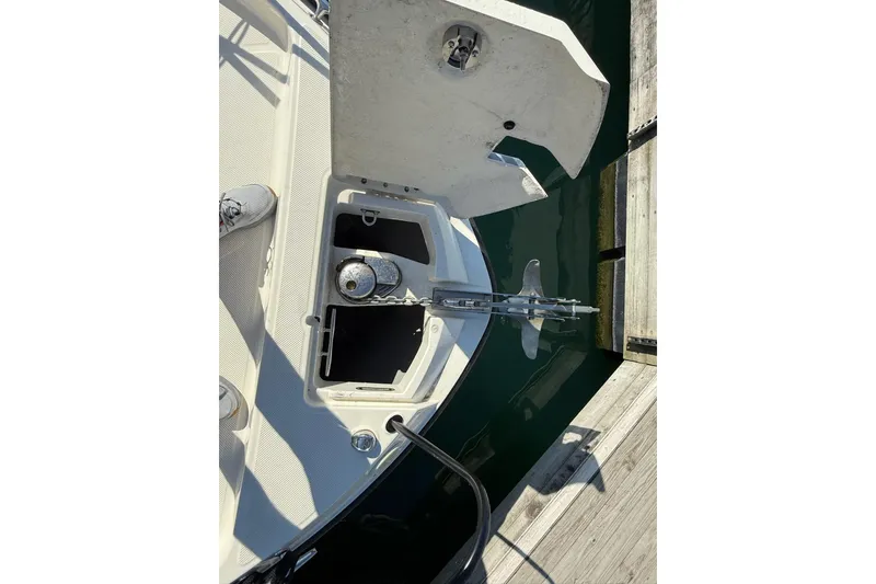 Slide: The Image of 2024 Bayliner Trophy T25 Pilothouse anchor compartment and deck detail at dock. - 24